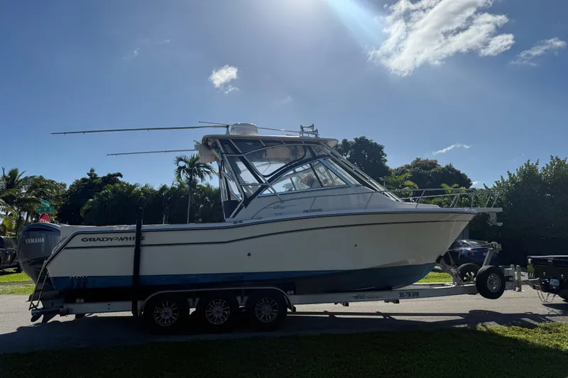  Yacht Photos Pics 2007 Grady-White Express 305 boat on trailer under sunny sky.