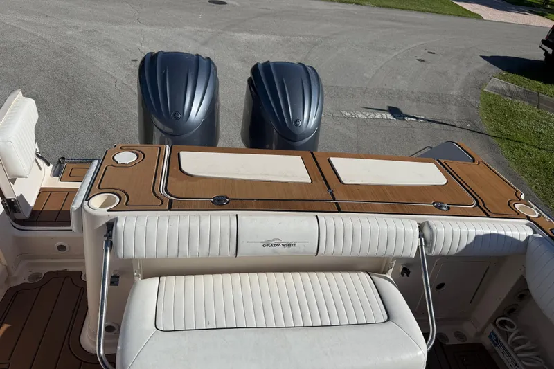  Yacht Photos Pics 2007 Grady-White Express 305 boat with dual outboard engines and cushioned seating.