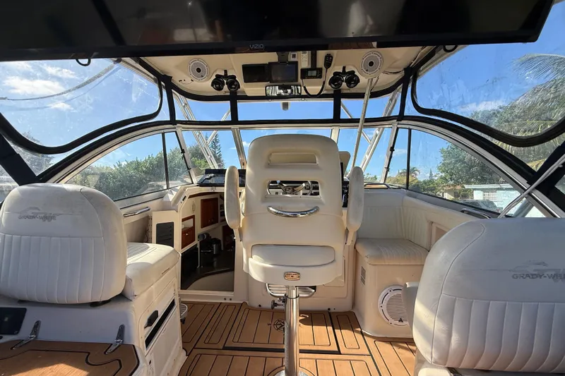  Yacht Photos Pics Interior of 2007 Grady-White Express 305 boat with white seating and wooden flooring.