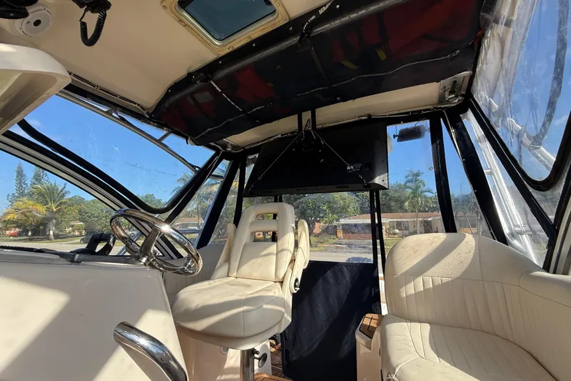  Yacht Photos Pics Interior of 2007 Grady-White Express 305 boat with steering wheel and seating.