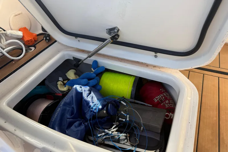  Yacht Photos Pics Storage compartment on 2007 Grady-White Express 305 boat with fishing gear and supplies.