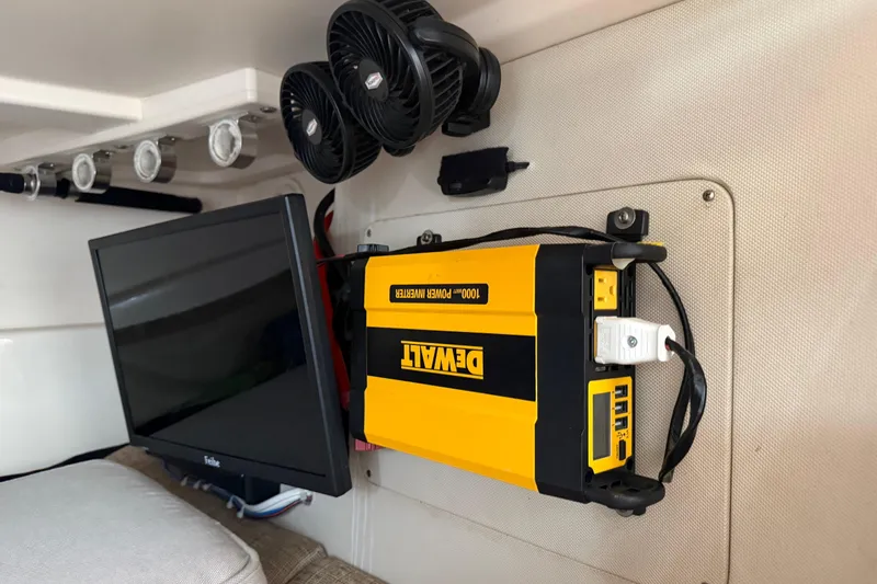  Yacht Photos Pics 2007 Grady-White Express 305 interior with DeWalt power inverter and monitor setup.