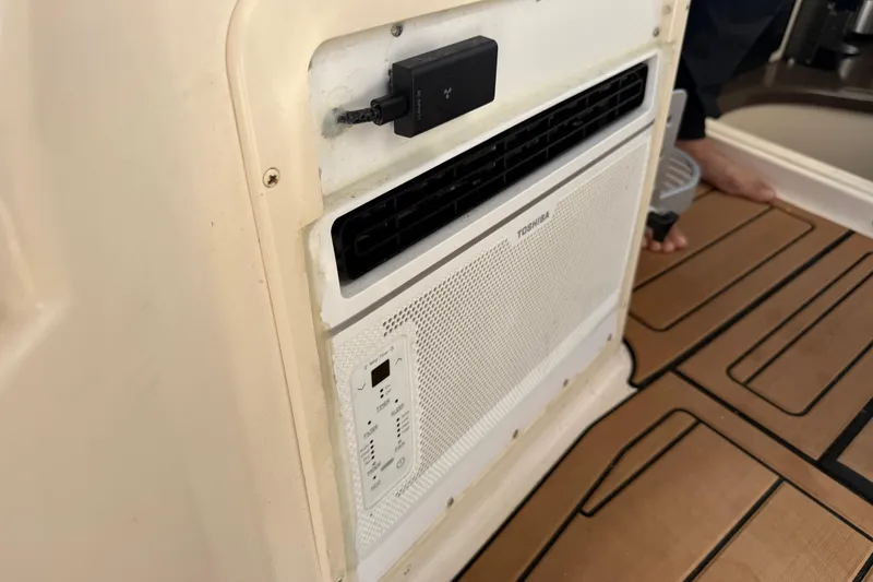  Yacht Photos Pics 2007 Grady-White Express 305 interior with Toshiba air conditioning unit.