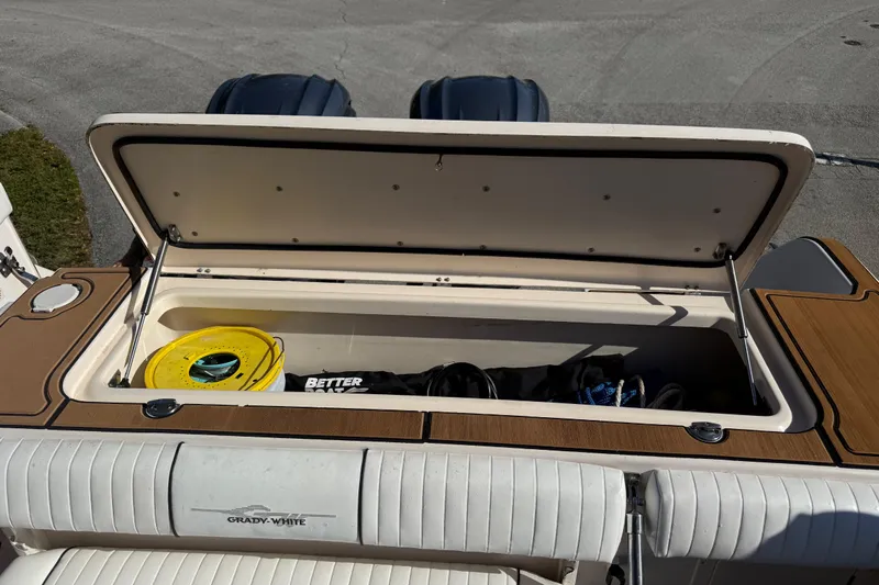  Yacht Photos Pics 2007 Grady-White Express 305 boat storage compartment with open lid, showing equipment inside.
