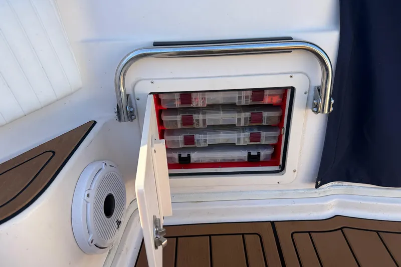  Yacht Photos Pics Storage compartment on 2007 Grady-White Express 305 boat with tackle boxes and speaker.