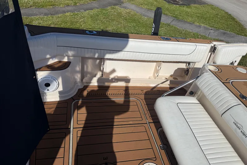  Yacht Photos Pics 2007 Grady-White Express 305 boat interior with cushioned seating and teak flooring.