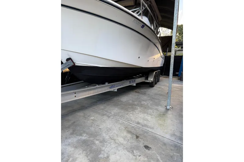  Yacht Photos Pics 2007 Grady-White Express 305 boat on trailer in covered storage.