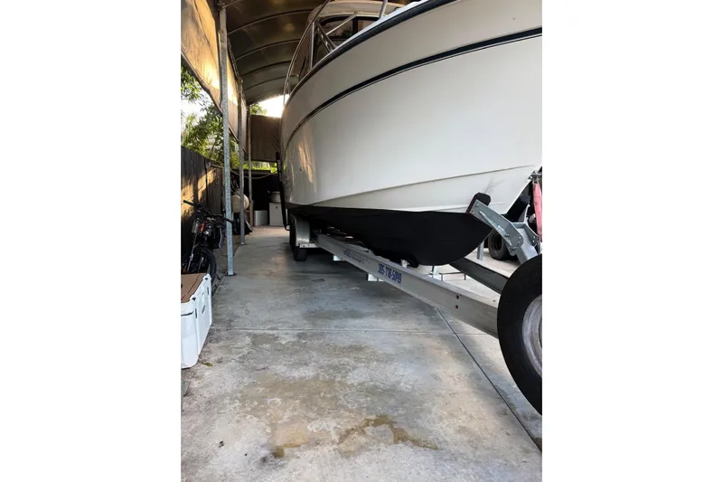 Yacht Photos Pics 2007 Grady-White Express 305 boat on trailer in covered storage area.