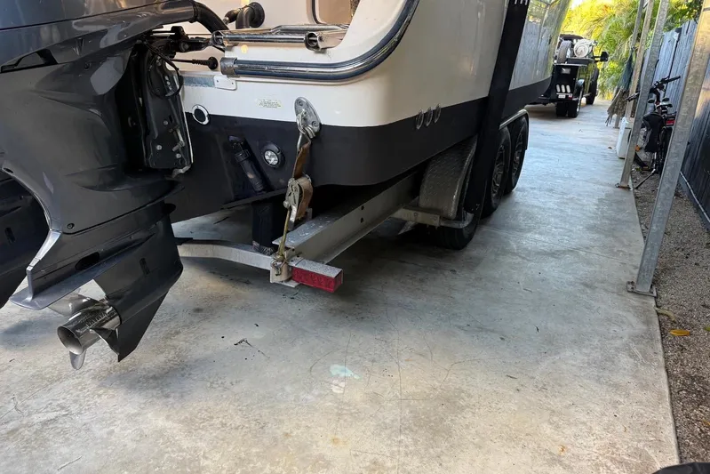  Yacht Photos Pics 2007 Grady-White Express 305 boat on trailer, parked in a covered area.