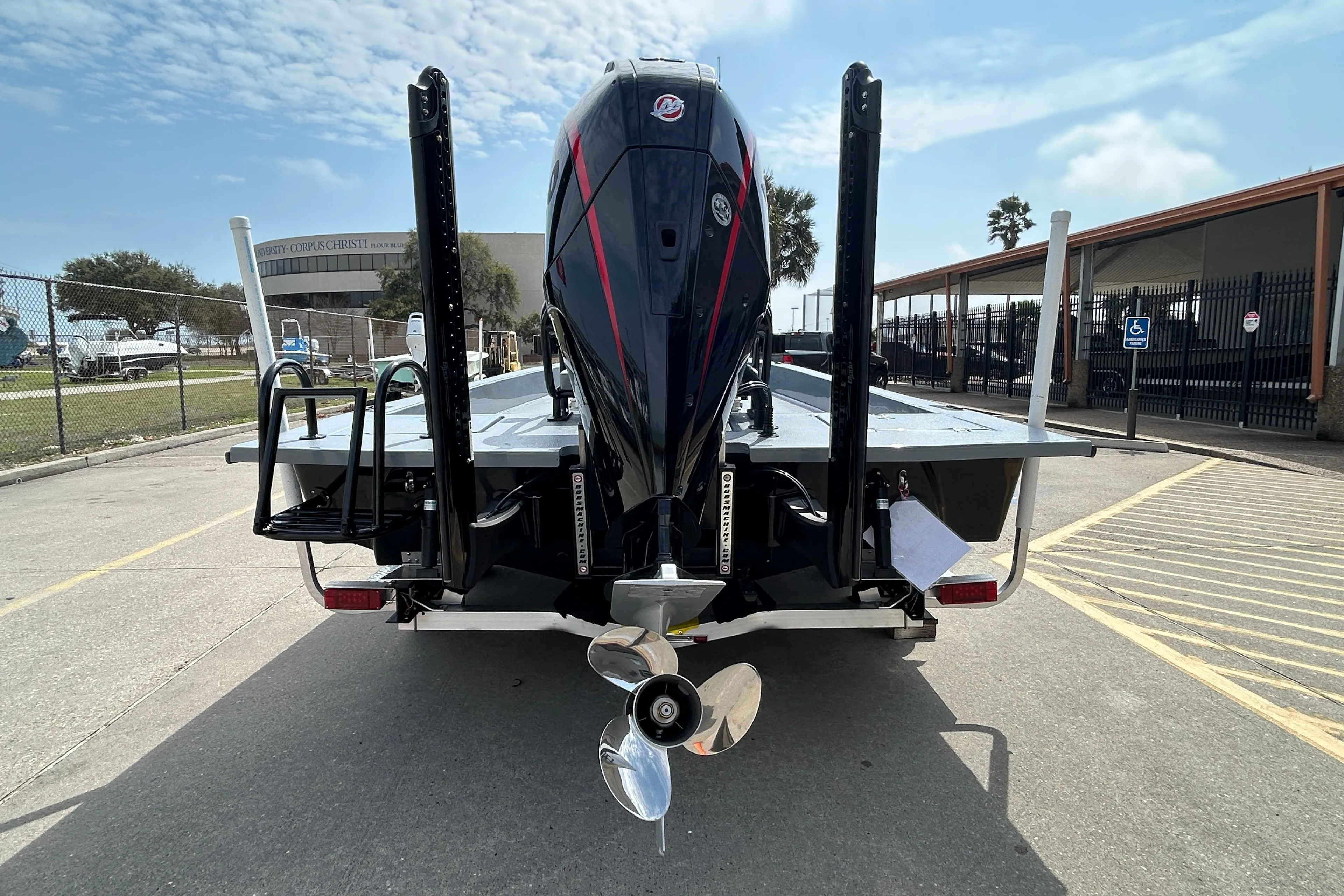 2026 Skuta 24 Vista boat rear view with powerful outboard motor.