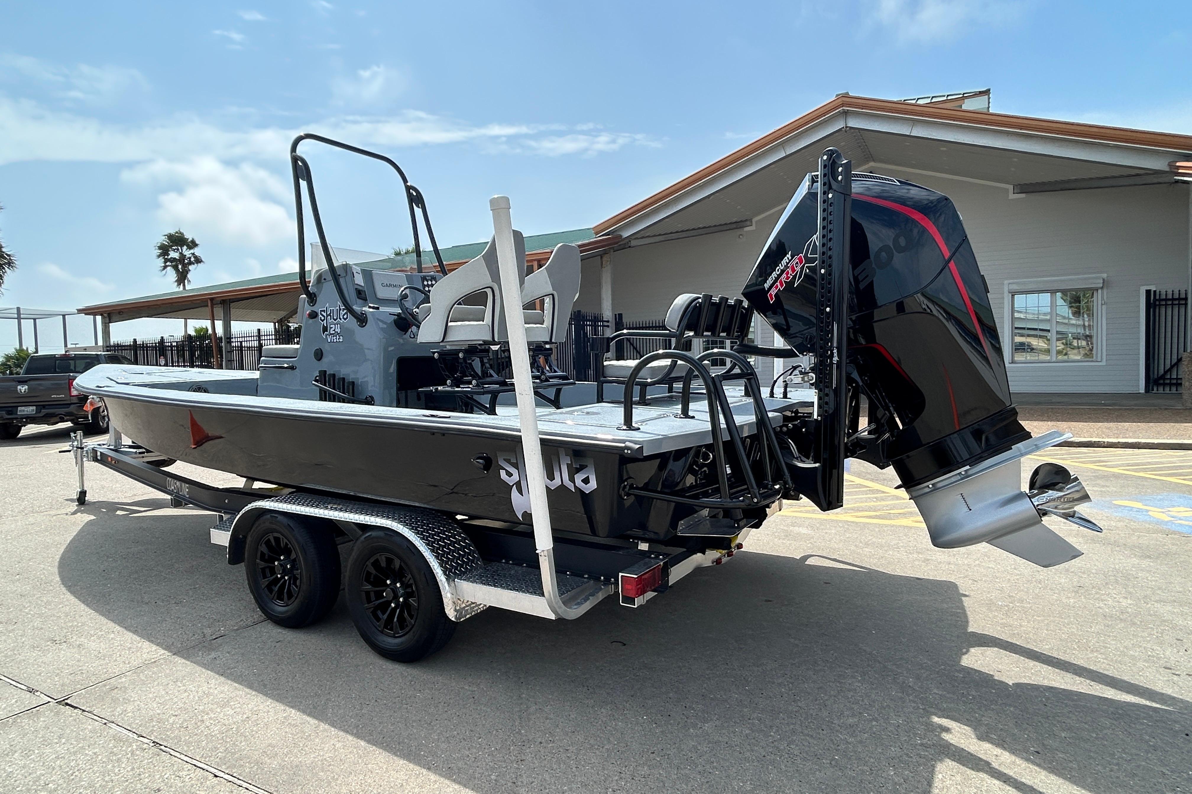 2026 Skuta 24 Vista boat on trailer with powerful outboard motor.