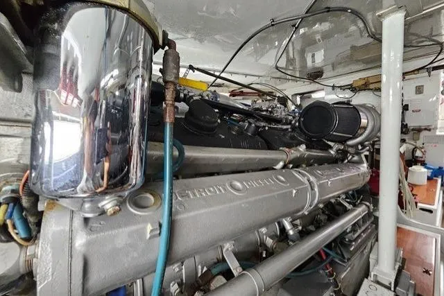 Andiamo Yacht Photos Pics Engine room of a 1991 Donzi 65 Sportfisher, showcasing detailed machinery and components.