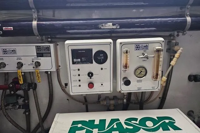 Andiamo Yacht Photos Pics Control panel of a 1991 Donzi 65 Sportfisher with Phasor generator components.