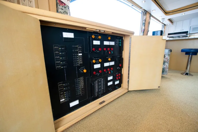 Andiamo Yacht Photos Pics Electrical panel inside 1991 Donzi 65 Sportfisher yacht, featuring control switches and indicators.