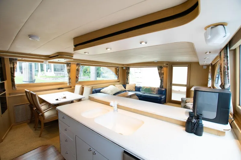 Andiamo Yacht Photos Pics Luxurious interior of a 1991 Donzi 65 Sportfisher yacht with modern amenities.