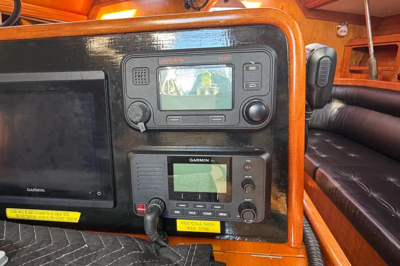 Halcyon Yacht Photos Pics Navigation equipment on a 2004 Alliaura FEELING 44 DI sailboat, featuring Garmin and em-trak devices.