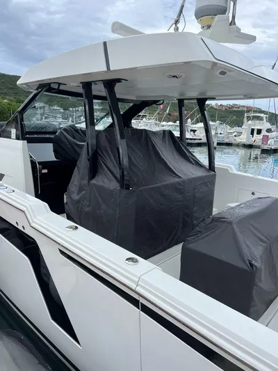  Yacht Photos Pics 2020 Ocean Alexander 45 Divergence boat docked at a marina, covered seating area.