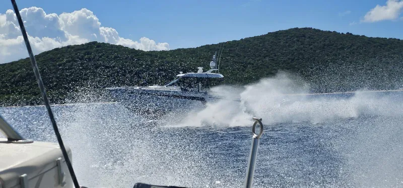  Yacht Photos Pics 2020 Ocean Alexander 45 Divergence cruising on the water near a lush green island.