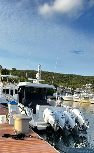  Yacht Photos Pics 2020 Ocean Alexander 45 Divergence docked at marina with triple outboard engines.