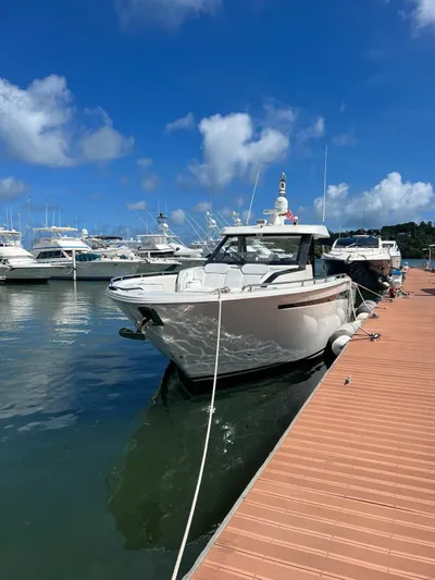  Yacht Photos Pics 2020 Ocean Alexander 45 Divergence yacht docked at a marina on a sunny day.