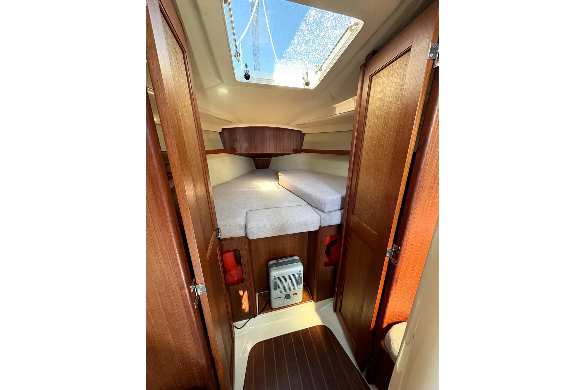 Interior of 1989 Hunter 30 sailboat with cozy cabin and wooden finish.