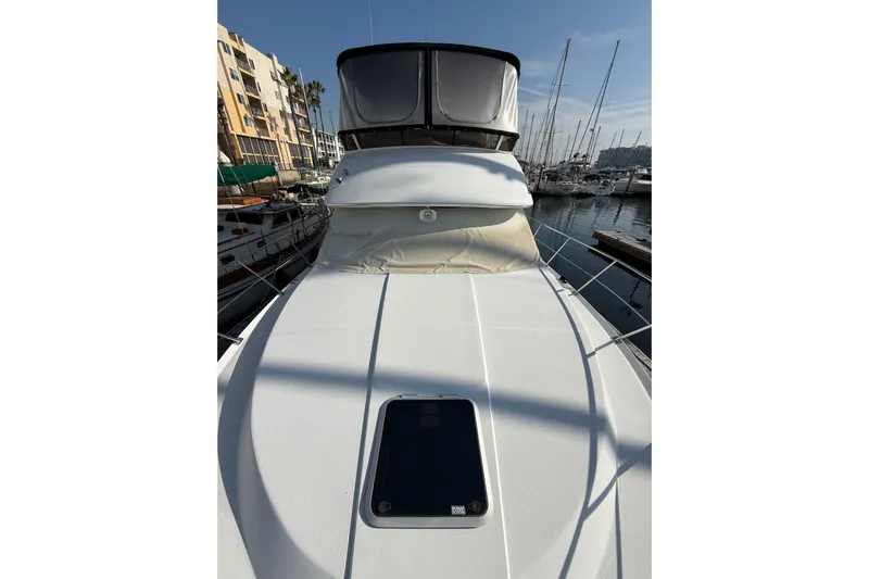 Il Danza Yacht Photos Pics 1999 Carver 406 Aft Cabin Motor Yacht docked in marina, sunny day.