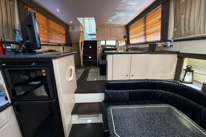 Il Danza Yacht Photos Pics Interior of 1999 Carver 406 Aft Cabin Motor Yacht with modern furnishings and cozy seating.