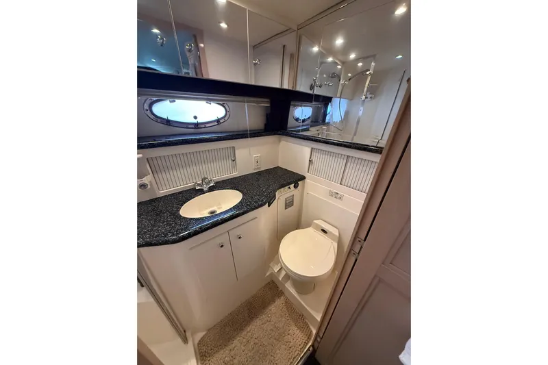 Il Danza Yacht Photos Pics Bathroom of 1999 Carver 406 Aft Cabin Motor Yacht with sink and toilet.