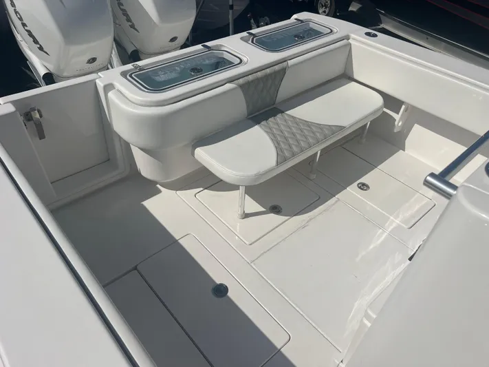  Yacht Photos Pics 2021 Contender 32 ST boat interior with seating and storage compartments.