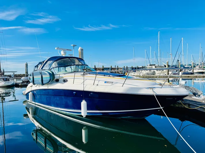 Tranquilo Yacht Photos Pics 2004 Sea Ray 360 Sundancer yacht docked in a marina under clear blue skies.
