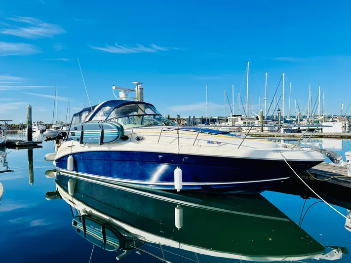 Tranquilo Yacht Photos Pics 2004 Sea Ray 360 Sundancer yacht docked in a marina under clear blue skies.