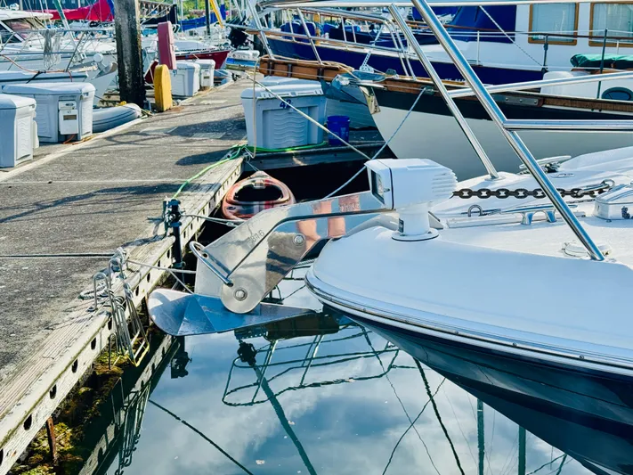 Tranquilo Yacht Photos Pics 2004 Sea Ray 360 Sundancer docked at marina, reflecting in calm water.