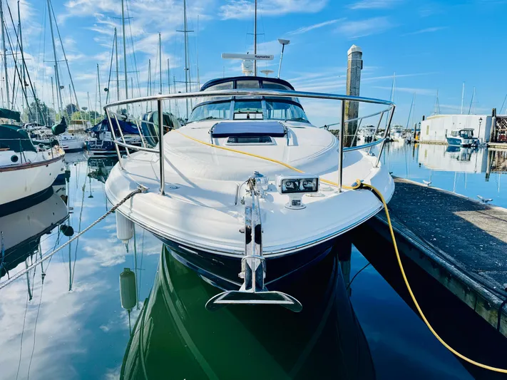 Tranquilo Yacht Photos Pics 2004 Sea Ray 360 Sundancer yacht docked in a marina under a clear blue sky.