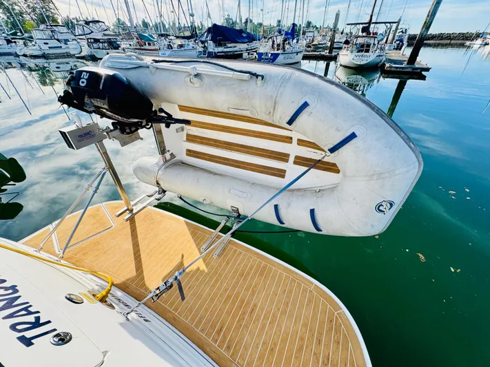 Tranquilo Yacht Photos Pics 2004 Sea Ray 360 Sundancer with dinghy on swim platform at marina.