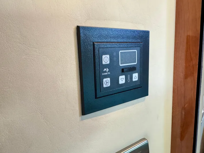 Tranquilo Yacht Photos Pics Control panel on 2004 Sea Ray 360 Sundancer yacht interior wall.