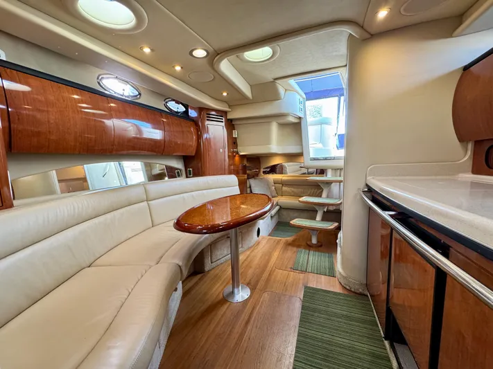Tranquilo Yacht Photos Pics Luxurious interior of 2004 Sea Ray 360 Sundancer yacht with elegant seating and wood finishes.