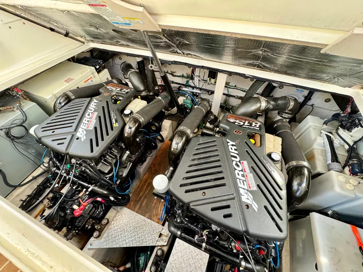 Tranquilo Yacht Photos Pics Engine compartment of a 2004 Sea Ray 360 Sundancer with twin Mercury engines.