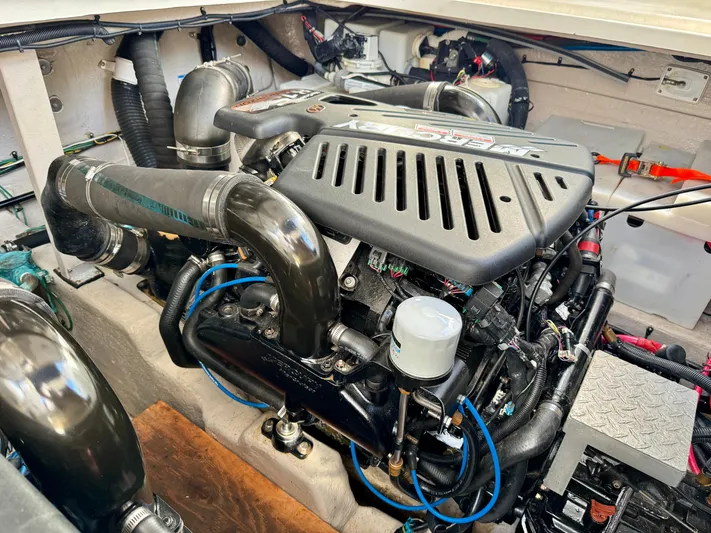 Tranquilo Yacht Photos Pics Engine compartment of a 2004 Sea Ray 360 Sundancer, showcasing detailed mechanical components.