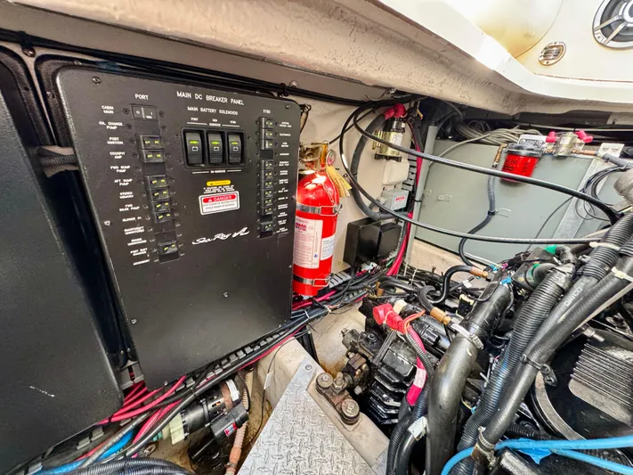 Tranquilo Yacht Photos Pics Engine compartment of a 2004 Sea Ray 360 Sundancer with electrical panel and fire extinguisher.