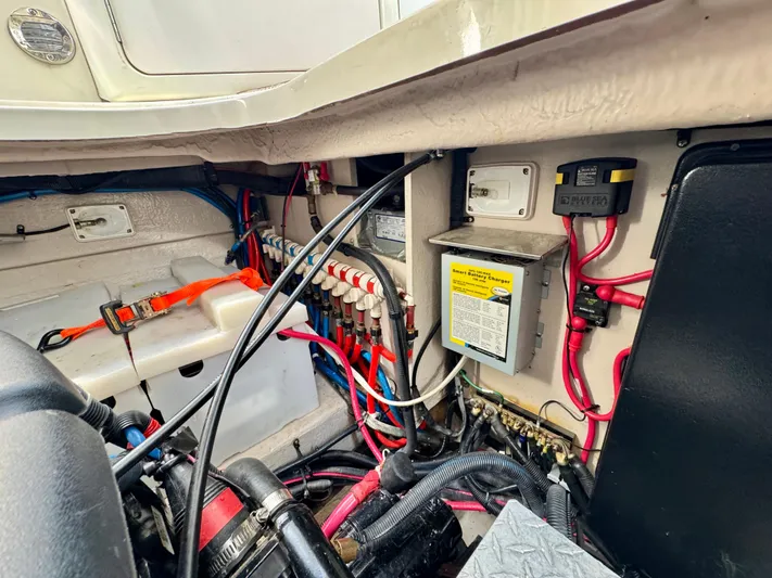 Tranquilo Yacht Photos Pics Engine compartment of a 2004 Sea Ray 360 Sundancer, showcasing wiring and electrical components.