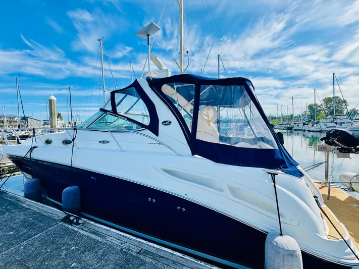Tranquilo Yacht Photos Pics 2004 Sea Ray 360 Sundancer docked at marina under blue sky.