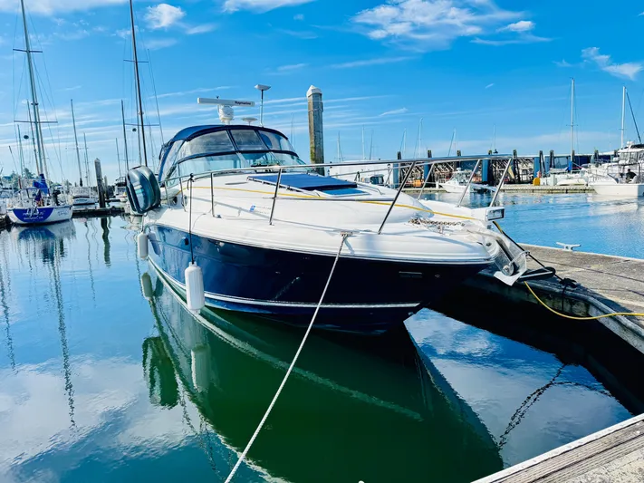 Tranquilo Yacht Photos Pics 2004 Sea Ray 360 Sundancer yacht docked in a sunny marina.