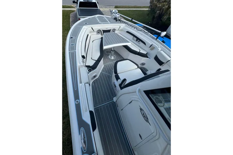  Yacht Photos Pics 2022 Tidewater 272 CC Adventure boat interior with sleek seating and modern design.
