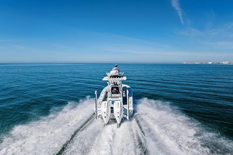  Yacht Photos Pics 2023 Barker Boatworks 26 Open cruising on open water under clear blue sky.