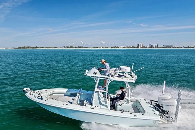  Yacht Photos Pics 2023 Barker Boatworks 26 Open cruising on clear blue water under a sunny sky.