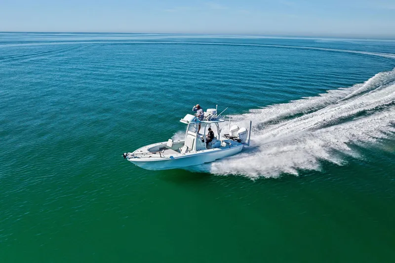  Yacht Photos Pics 2023 Barker Boatworks 26 Open cruising on clear blue ocean waters.