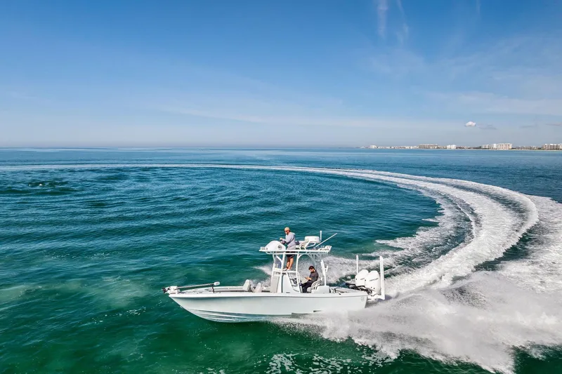  Yacht Photos Pics 2023 Barker Boatworks 26 Open cruising on clear blue ocean waters.