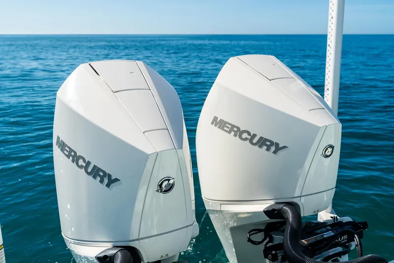  Yacht Photos Pics Twin Mercury outboard engines on a 2023 Barker Boatworks 26 Open, cruising on open water.