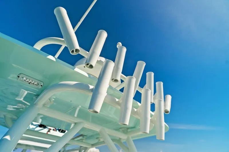  Yacht Photos Pics 2023 Barker Boatworks 26 Open rod holders against a clear blue sky.