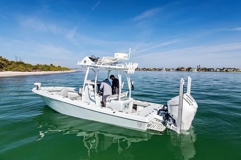  Yacht Photos Pics 2023 Barker Boatworks 26 Open on calm water near a scenic shoreline.